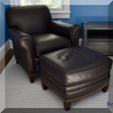F31. Hancock & Moore leather chair and ottoman with nailhead trim. 32”h x 35”w x 36”d 